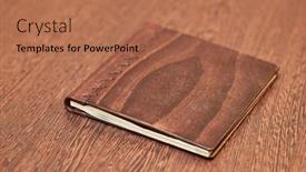  Presentation with note book - Slide deck featuring note-book-with-hard-wooden background and a  colored foreground