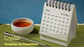  Presentation with november - PPT theme consisting of november-2020-spiral-desktop-calendar background and a tawny brown colored foreground