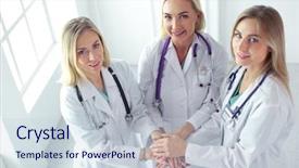  Presentation with multiracial team of young doctors stacking hands - PPT theme with nurses in a medical team background and a  colored foreground