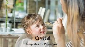  Presentation with spoon - Amazing PPT theme having nutrition month - mum spoon-feeds her child backdrop and a  colored foreground