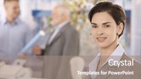  Presentation with coworkers - Theme consisting of office portrait of mid adult businesswoman looking at camera smiling coworkers in background background and a gray colored foreground