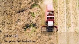  Presentation with trucking - Theme with oilfield trucking - aerial view of combine harvester background and a coral colored foreground