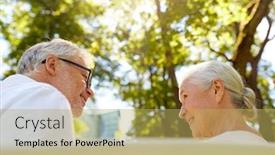  Presentation with old age - PPT theme enhanced with old age relationship and people concept - happy senior couple sitting on bench at summer city park background and a yellow colored foreground