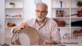  Presentation with old - PPT theme having old-male-repairman-repairing-musical background and a coral colored foreground