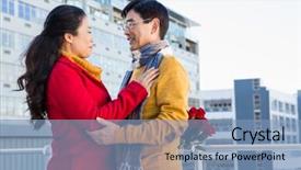  Presentation with older couple - Presentation consisting of older asian couple on balcony with gift on a cold day background and a teal colored foreground