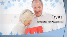  Presentation with older couple - Beautiful PPT theme featuring older couple holding red gift bag against snow flake frame in blue backdrop and a soft green colored foreground