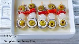  Presentation with tapas - Presentation featuring olives anchovies and pickled onion red pepper pinchos tapas from spain background and a light blue colored foreground