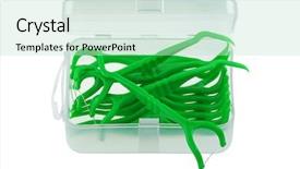  Presentation with dental floss - Colorful presentation theme enhanced with oral device a box of green dental flossers floss pick to eliminate food and dental plaque between teeth isolated on white backdrop and a soft green colored foreground