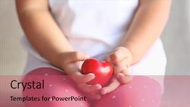  Presentation with child adoption - Beautiful presentation theme featuring orphange - child holding small red heart backdrop and a coral colored foreground