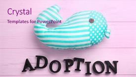  Presentation with wooden toy - Amazing slide deck having orphange - word adoption and whale toy backdrop and a pink colored foreground