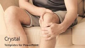  Presentation with leg pain - Beautiful theme featuring young man suffering from pain in leg at home closeup backdrop and a coral colored foreground