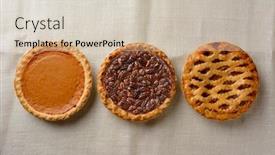  Presentation with baked pies - Presentation having overhead still life of fresh baked pecan pumpkin and apple pies on a burlap table cloth background and a soft green colored foreground