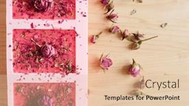  Presentation with molds - Slide deck enhanced with overview of silicone molds filled with handmade pink soap sprinkled by grated dry floral petals with small rosebuds on top and near background and a lemonade colored foreground
