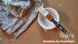  Presentation with diy - PPT theme consisting of paining-brush-and-paint background and a tawny brown colored foreground