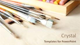  Presentation with colorful fabric - Audience pleasing theme consisting of paintbrushes with colorful chalk pastels in box on fabric background backdrop and a cream colored foreground