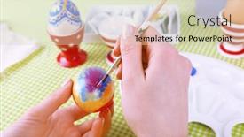  Presentation with colorful hands - Colorful presentation design enhanced with painting easter eggs by female hands on colorful tablecloth background backdrop and a soft green colored foreground