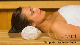  Presentation with peaceful - PPT layouts with peaceful brunette relaxing in a sauna lying down wearing white towel background and a gold colored foreground