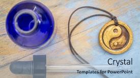  Presentation with aromatherapy oil - Theme having pendant with yin and yang background and a light blue colored foreground