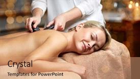  Presentation with spa concept stone - Presentation theme having people beauty spa healthy lifestyle and relaxation concept - close up of beautiful young woman having hot stone massage in spa background and a coral colored foreground