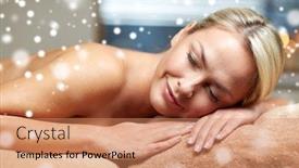  Presentation with relaxation - Presentation consisting of people beauty spa winter and relaxation concept - beautiful young woman lying on massage table in spa salon with snow effect background and a coral colored foreground