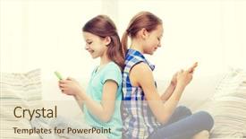  Presentation with smartphones - Presentation theme featuring people children technology friends and friendship concept - happy little girls with smartphones sitting on sofa back to back at home background and a soft green colored foreground