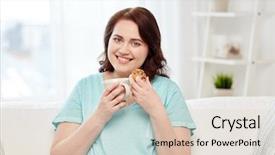  Presentation with junk food - Presentation with people junk food unhealthy eating and leisure concept - happy plus size young woman with cup of tea with cookie at home background and a lemonade colored foreground