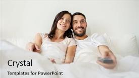  Presentation with relationships - PPT layouts enhanced with people rest love relationships and television concept - happy couple with remote lying in bed at home and watching tv background and a soft green colored foreground