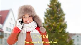  Presentation with town hall - Presentation theme consisting of people season and leisure concept - happy smiling woman in winter fur hat calling on smartphone over christmas tree at tallinn old town hall square background background and a tawny brown colored foreground