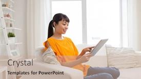  Presentation with technology - Presentation consisting of people technology and leisure concept - happy young asian woman sitting on sofa with tablet pc computer at home background and a coral colored foreground