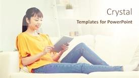  Presentation with computer music - Theme featuring people technology and leisure concept - happy asian young woman sitting on sofa with tablet pc computer and earphones listening to music at home background and a cream colored foreground