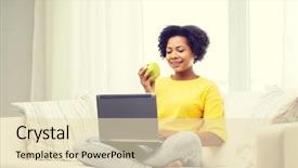  Presentation with african people - PPT theme consisting of people technology and leisure concept - happy african american young woman sitting on sofa with laptop computer and drinking tea from cup at home background and a lemonade colored foreground