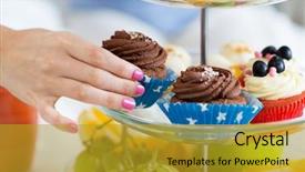  Presentation with cupcake cake - Cool new theme with people unhealthy eating and junk food concept - close up of hand taking cupcake from cake stand backdrop and a gold colored foreground