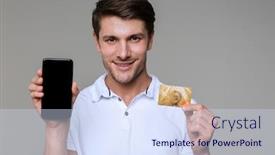  Presentation with photo display - Colorful presentation enhanced with photo of a cheerful handsome man posing isolated over grey wall background holding debit card using mobile phone showing display backdrop and a sky blue colored foreground