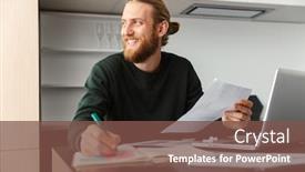  Presentation with writing notes - Audience pleasing slides consisting of photo of a handsome young bearded man sitting at the kitchen writing notes in documents using laptop computer backdrop and a tawny brown colored foreground
