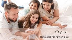  Presentation with family photo - Presentation design consisting of photo of happy family with two children laughing and taking selfie on smartphone while lying together on bed in apartment background and a coral colored foreground