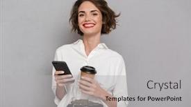  Presentation with takeaway coffee - PPT theme consisting of photo of pleased woman 20s holding takeaway coffee and using mobile phone isolated over gray background background and a light gray colored foreground