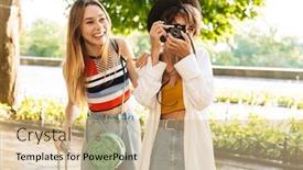  Presentation with women retro - Cool new PPT layouts with photo of two cheerful attractive women taking photo on retro camera while walking with suitcases at green city boulevard backdrop and a lemonade colored foreground