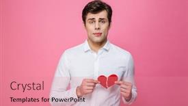  Presentation with broken heart - Presentation theme enhanced with photo of young sad man standing isolated over pink background holding broken heart looking camera background and a coral colored foreground