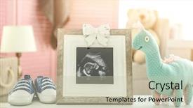  Presentation with baby ultrasound - Slide deck having photo toy and baby shoe background and a soft green colored foreground