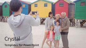  Presentation with family - Slide set having photographing family standing at beach background and a  colored foreground