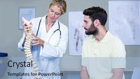  Presentation with spine - PPT theme having physiotherapist explaining the spine model background and a light blue colored foreground