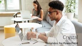  Presentation with coworking - Slides featuring picture of concentrated young african man sitting coworking by laptop computer looking aside background and a mint green colored foreground