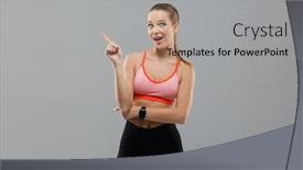  Presentation with sports - PPT theme with picture of happy young sports woman standing isolated over grey background looking camera and pointing background and a light gray colored foreground