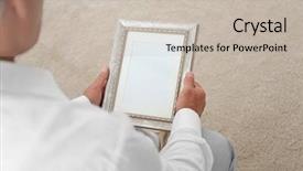  Presentation with nostalgia - Amazing presentation theme having man holding photo frame memories backdrop and a soft green colored foreground