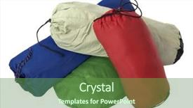  Presentation with tent - Presentation having pile of colorful bags with camping equipment tent sleeping bag pad isolated on white background and a tawny brown colored foreground