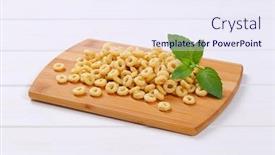  Presentation with cutting-board - PPT theme enhanced with pile of honey cereal rings on wooden cutting board background and a sky blue colored foreground