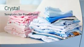  Presentation with baby clothes - Amazing PPT theme having pink blue - pile of baby clothes close backdrop and a sky blue colored foreground