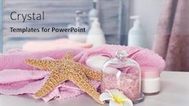  Presentation with table salt - Theme enhanced with pink towel with salt and starfish on bathroom table background and a light gray colored foreground
