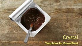  Presentation with yogurt - PPT theme having plastic cup with yummy chocolate yogurt on wooden table background and a tawny brown colored foreground