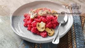  Presentation with beetroot - Theme featuring plate of tasty beetroot risotto with mushrooms on table closeup background and a coral colored foreground